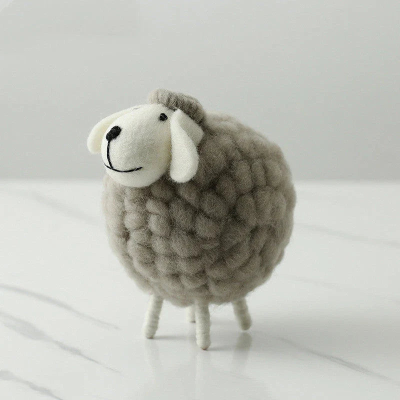 Adorable plush sheep decorations in various sizes and color combinations, perfect for adding a cozy, farmhouse-inspired touch to any home.