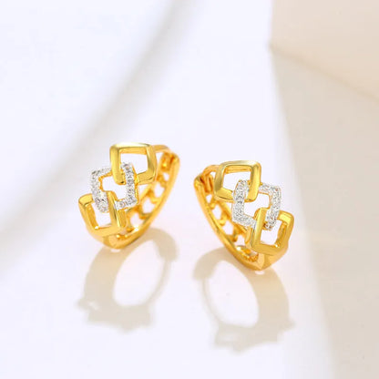 Gold geometric hollow-out alloy stud earrings on a plain background.