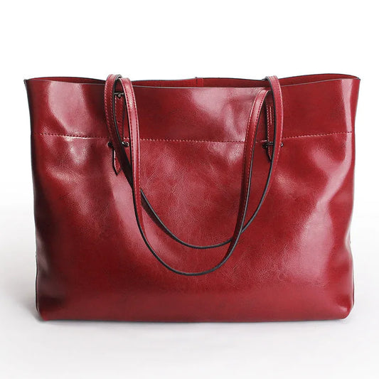 Leather cross-body handbag in Black colour with dimensions 30cm by 37cm by 13cm, showing internal pockets