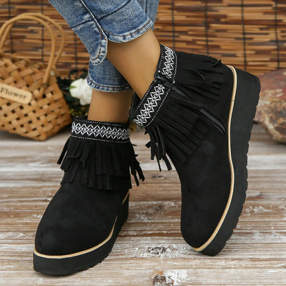 Women's thick bottom wedge bootie in suede with side zipper and tassel detail, available in multiple colours.