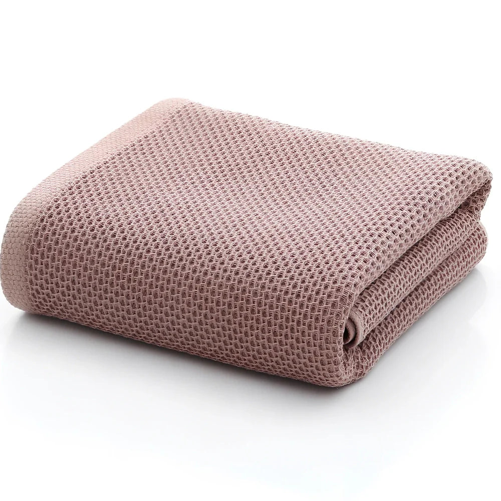 100% cotton honeycomb weave face towel in blue colour showing textured pattern and 70x140cm dimensions