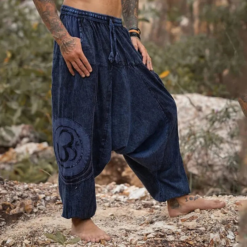 Dark green ethnic patterned men's trousers with ankle ties and mid waist fit