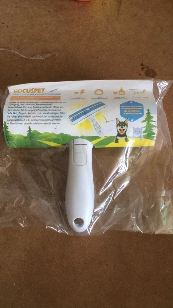 Blue pet hair removal comb with ABS plastic body and roller bristles for furniture cleaning