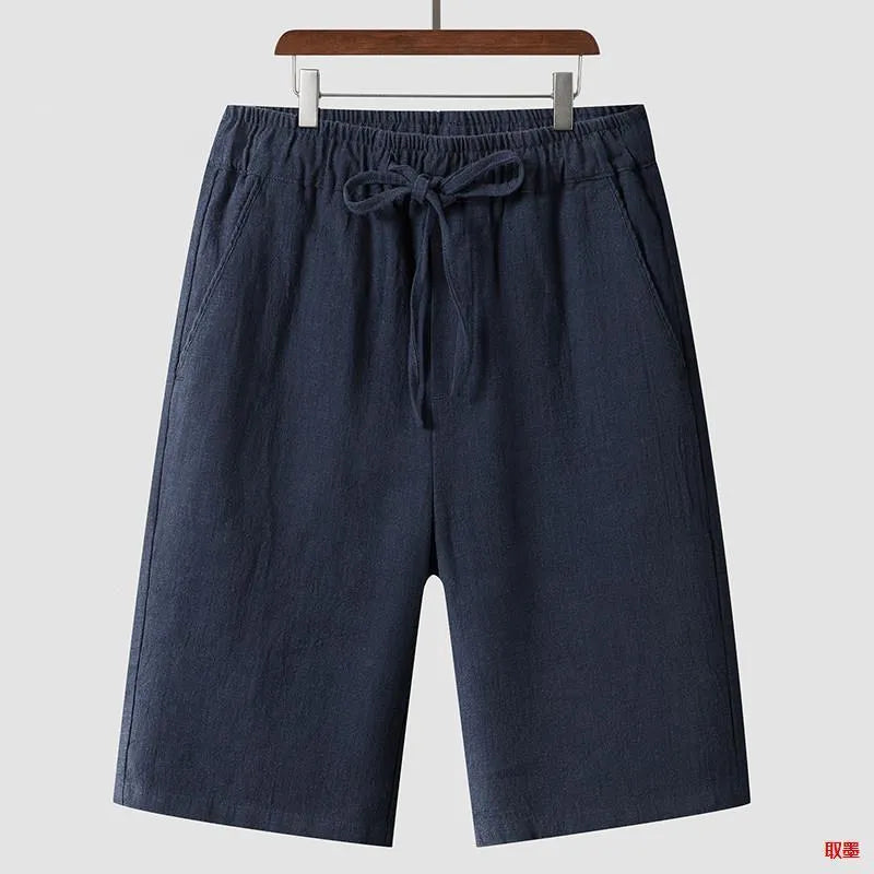 Men's linen casual shorts with elastic waistband in loose cropped design showing beige colour option