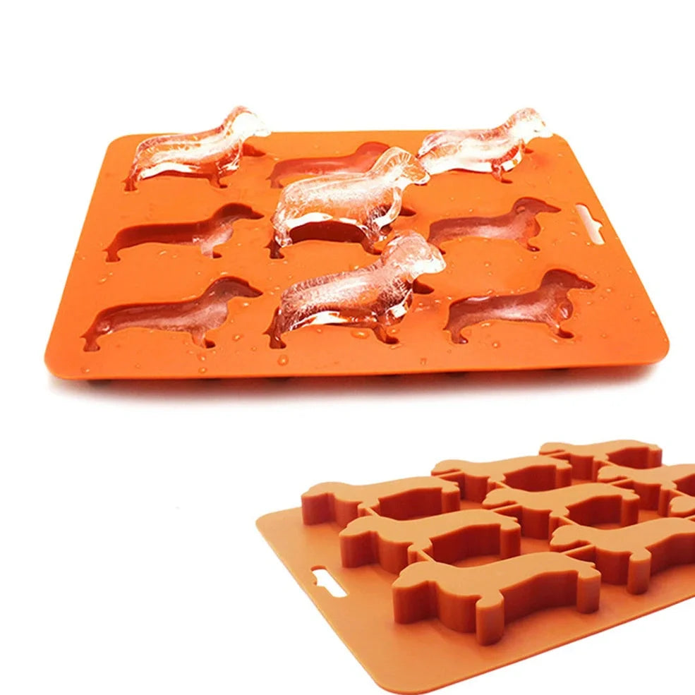 Orange silicone ice mould with 12 animal-shaped compartments for making decorative ice cubes