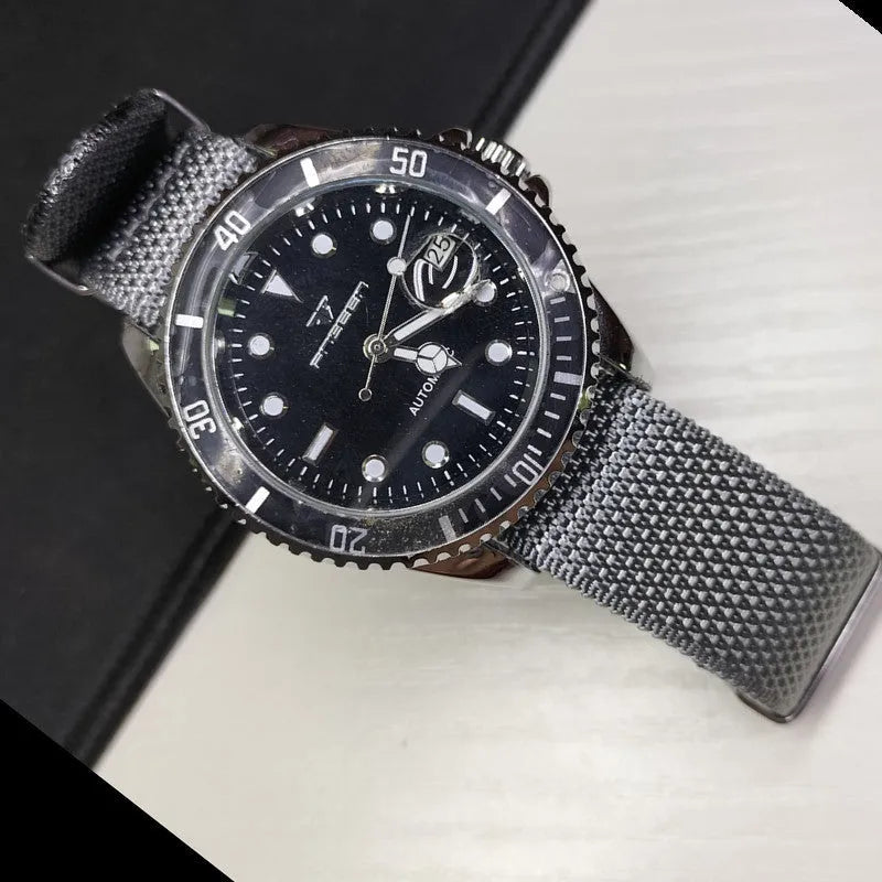 Integrated nylon watch strap in Army Green colour showing textile construction and attachment to watch lugs