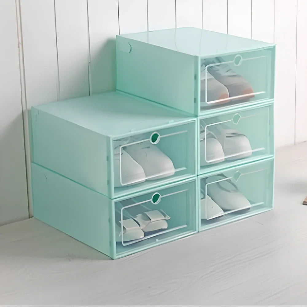 Transparent plastic shoe box showing stackable design and clear construction