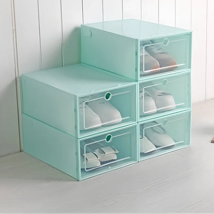 Transparent plastic shoe box showing stackable design and clear construction