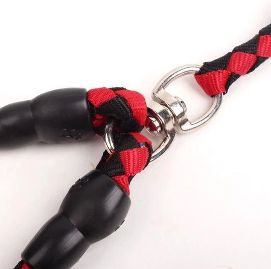 Double-ended dog walking rope with padded handles and reflective threads, showing metal clip hooks