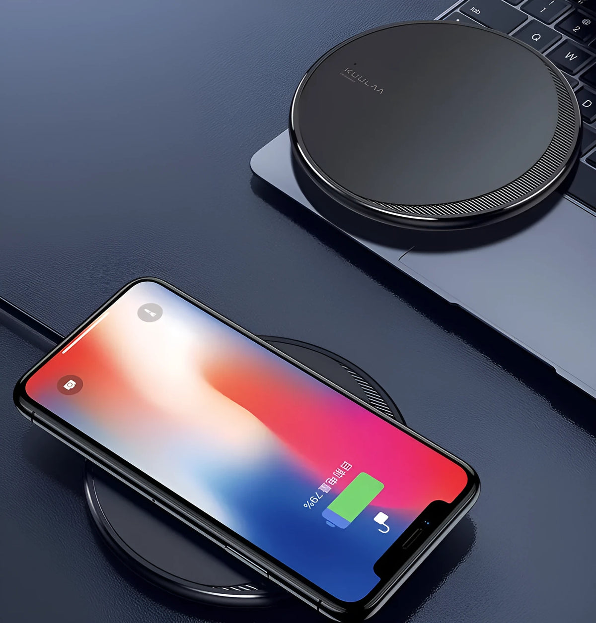 Black Kuulaa KL-CD16 wireless disc charger for mobile phones on a surface.