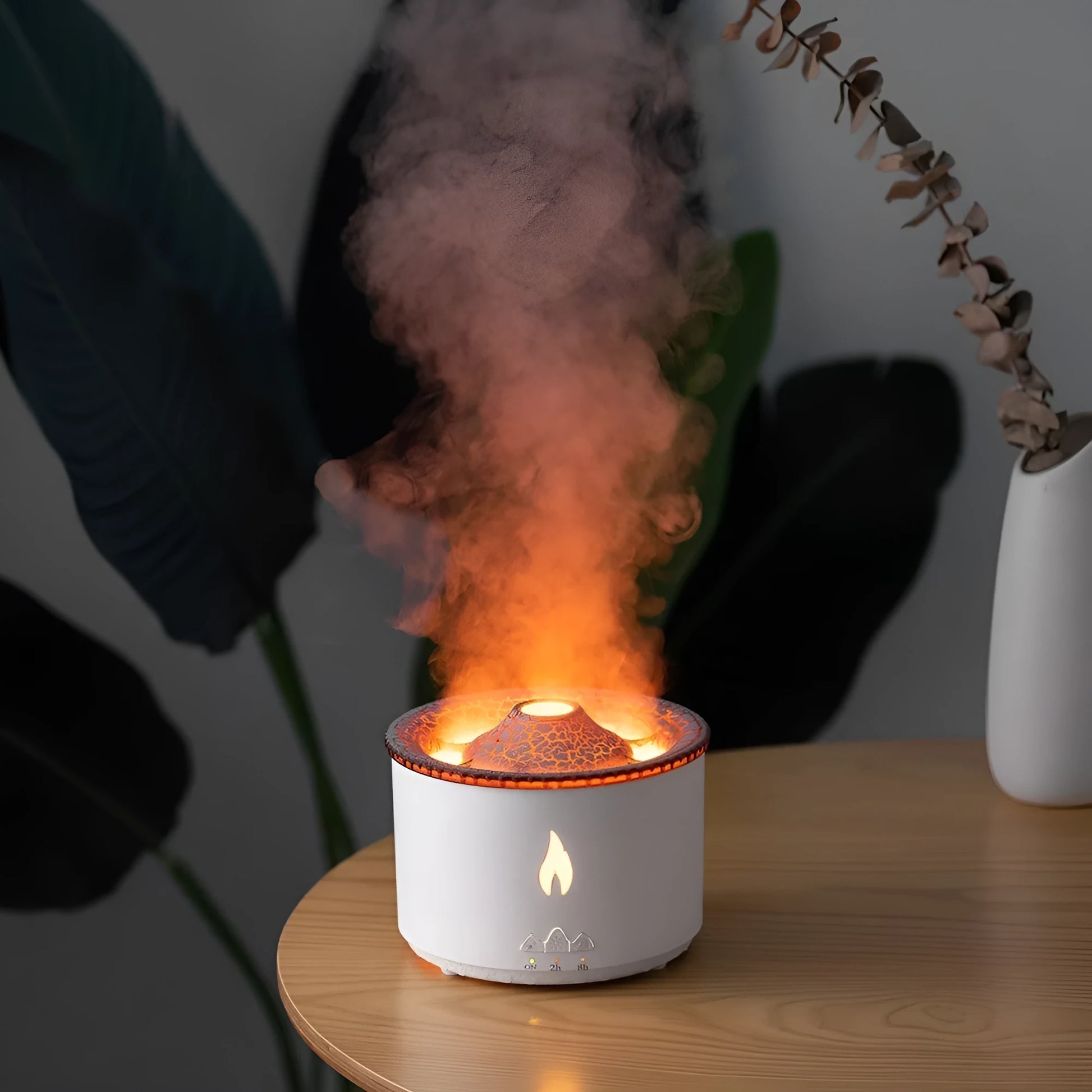 Colourful volcano-shaped cool mist humidifier with aromatherapy tray and flame-effect night light.