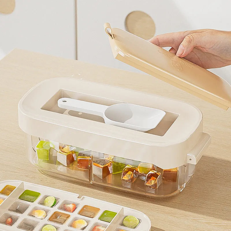 Yellow and blue food grade plastic ice cube trays with ice shovel stored in dedicated slot