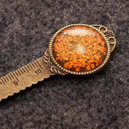 12cm handmade dried flower bookmark with gypsophila ruler featuring lace flowers, daffodils, and clover on blue background