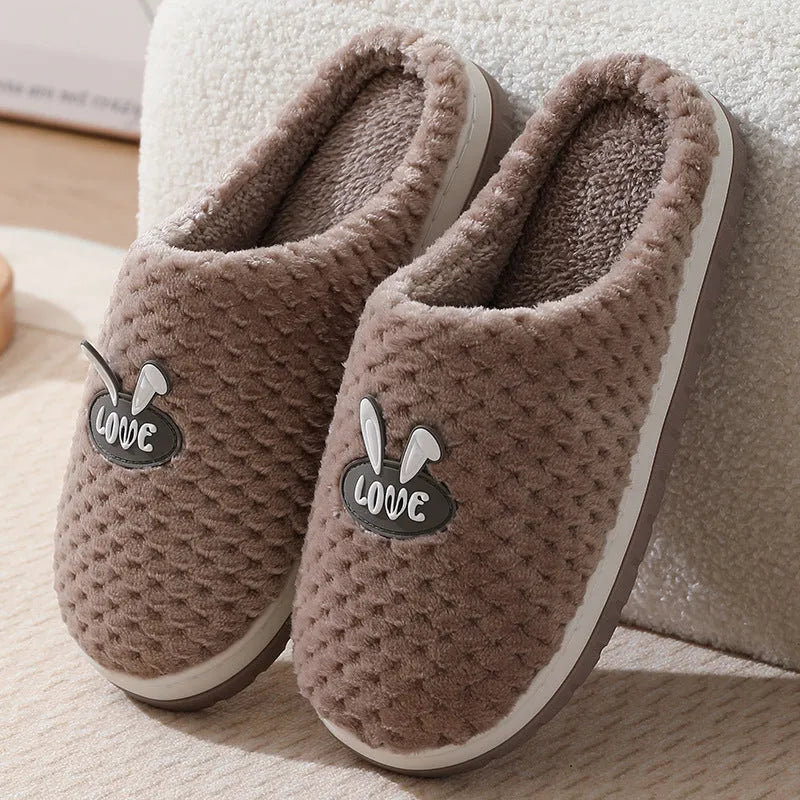 Women's plush rabbit plaid design winter slippers with a thick light-coloured rubber sole.