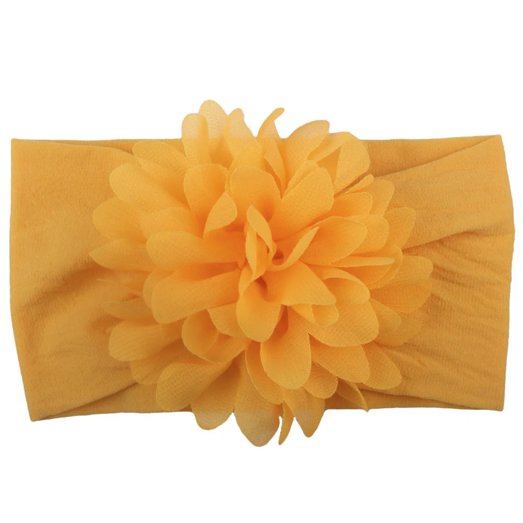 Adorable chiffon flower baby headband for your little princess, available in multiple colors.
