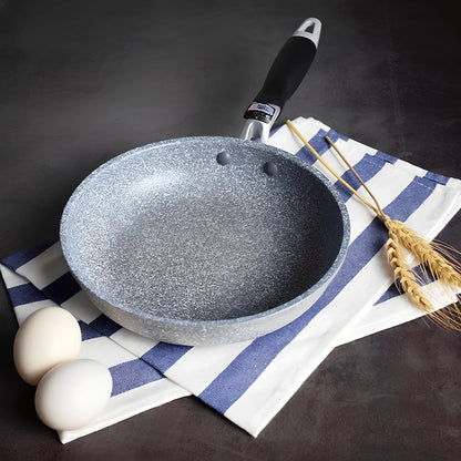 Japanese-style Maifan stone frying pan with glass lid showing non-stick surface and compound bottom