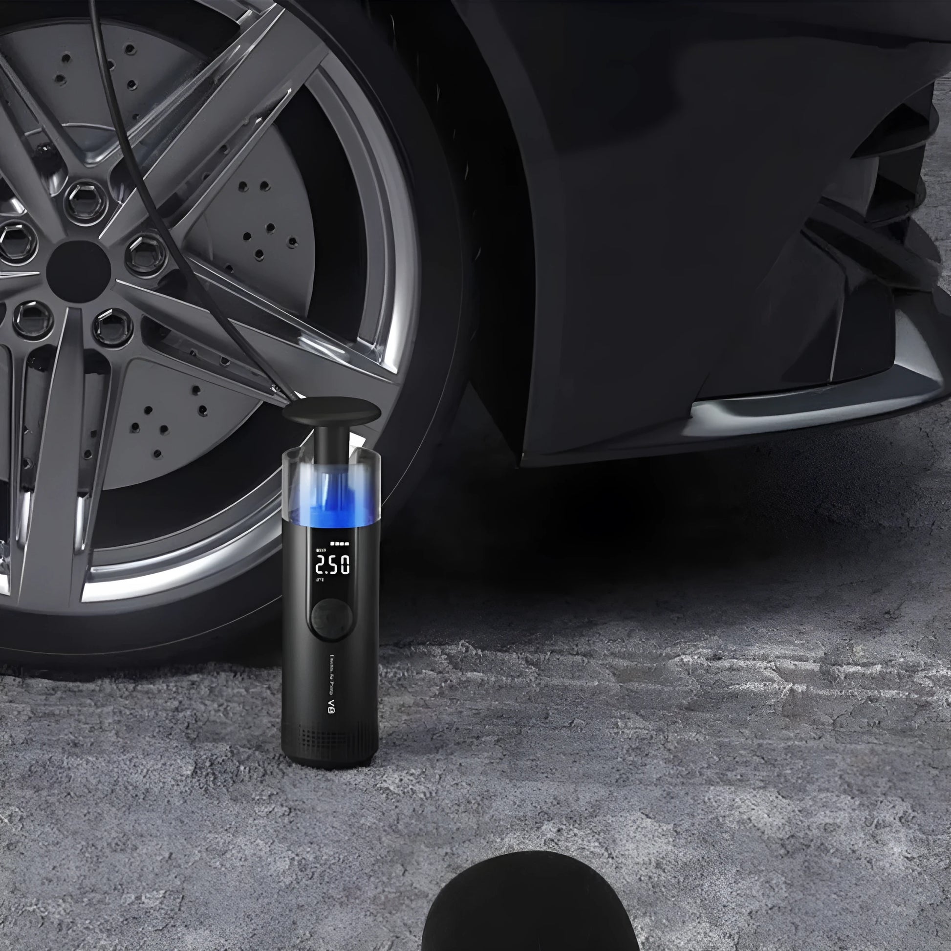 Wireless digital display car tyre inflator with long hose and tyre pressure gauge.