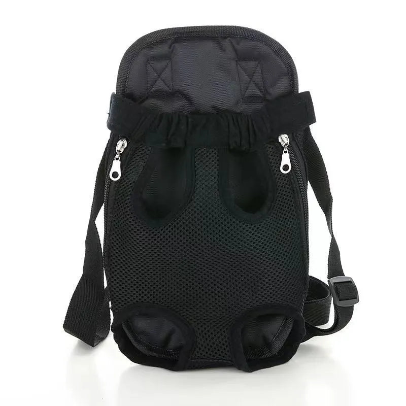 A small dog in a front-worn nylon carrier backpack with mesh panels, adjustable straps and side zips.