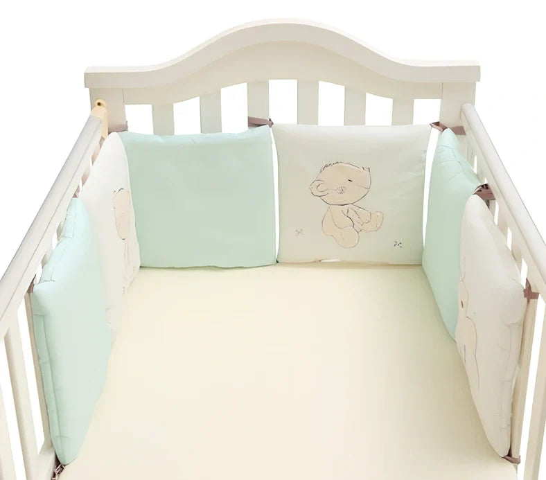 Six 30x30cm cotton baby bed protection panels with hard cotton filling arranged around crib
