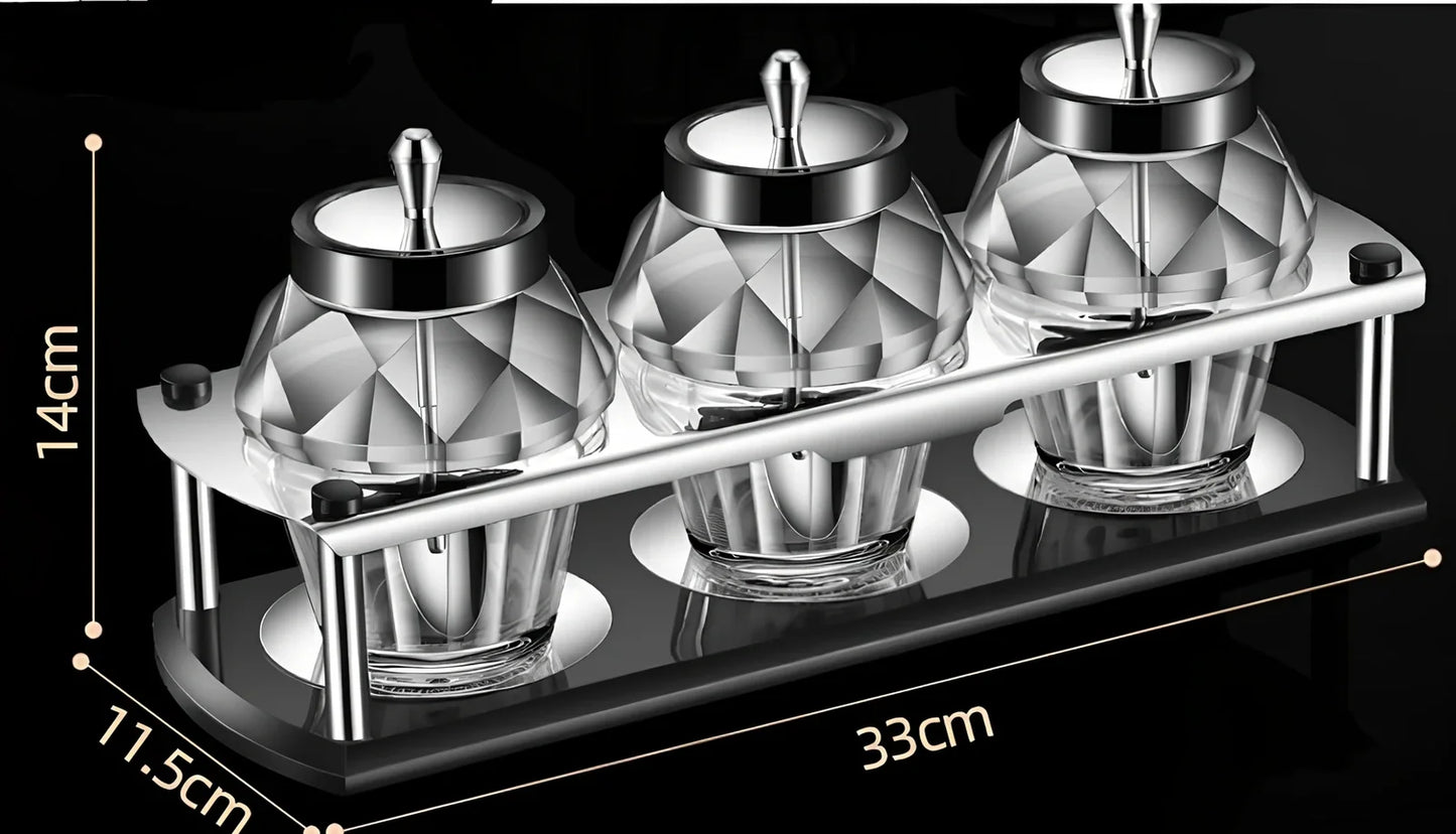 Glass seasoning jar with spoon cover for solid spices like salt and pepper on kitchen counter