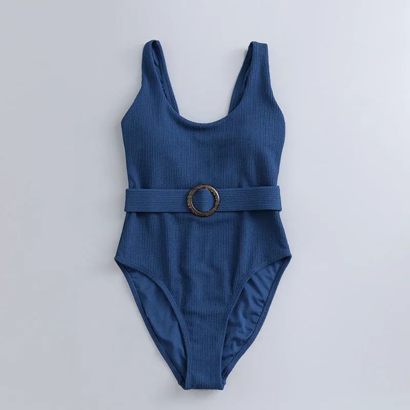 Navy blue women's one-piece swimsuit with triangle top and built-in chest pads for swimming