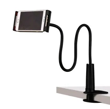 Bedside oversize flat panel handset with long arm holding a mobile phone on a table