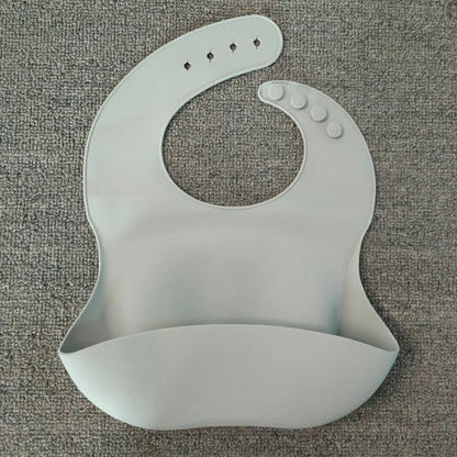 Soft waterproof silicone baby bib with food catcher in various colors