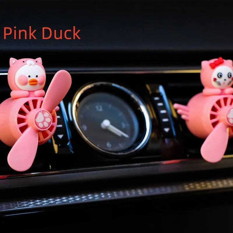 Set of four animal-themed car air vent clip ornaments: black husky, black cat, pink cat, and pink duck.