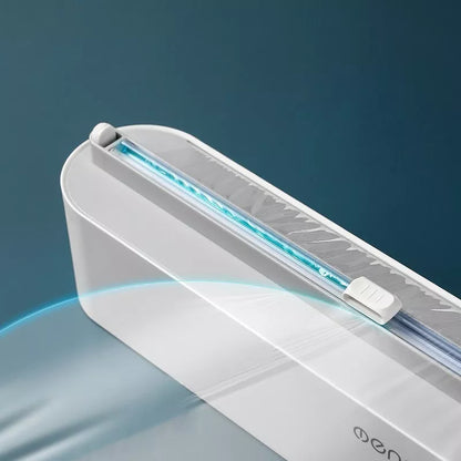 Black and gray plastic wrap dispenser with sharp cutter for kitchen