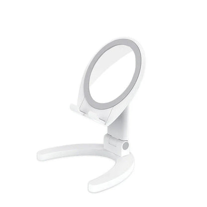 Adjustable mobile phone stand with integrated makeup mirror, featuring a sleek and versatile design for hands-free use and on-the-go touch-ups.