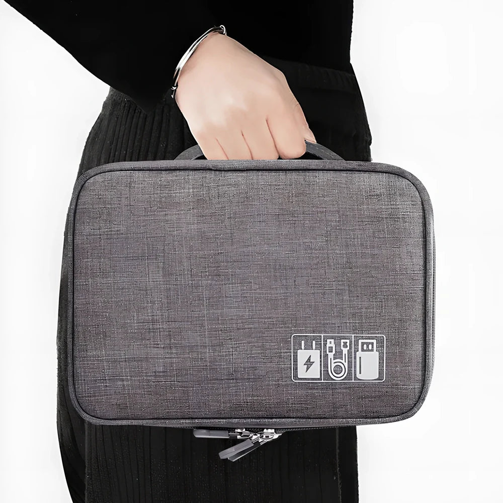 Gray waterproof electronics organiser bag open showing double-layer compartments with elastic loops and mesh pouches
