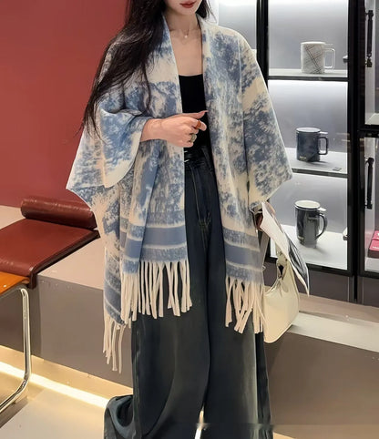 Women's polyester tassel scarf cape in free-size design showing 15 cm fringe detailing and shawl-style drape