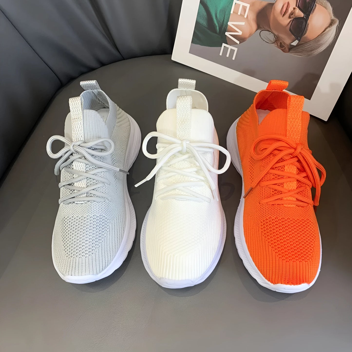 Women's low-top mesh Flyknit tennis shoes in creamy white, with a rubber sole and round toe.