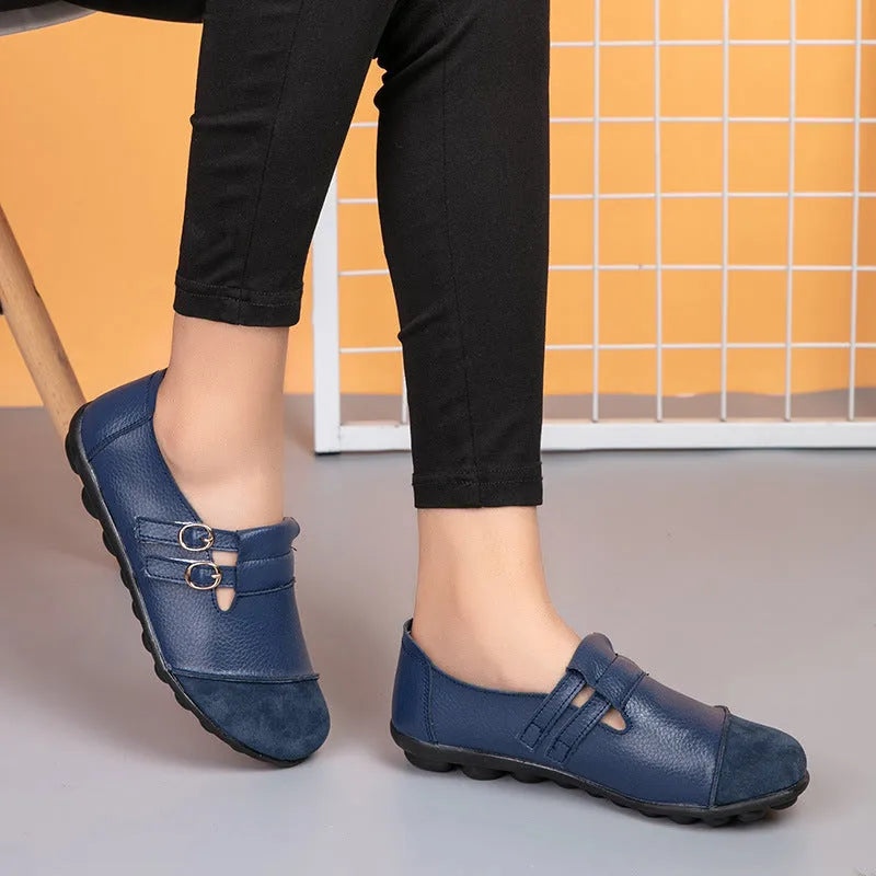 Women's low-top casual shoes in black with Velcro strap and rounded toe, showcasing cow split leather upper and beef tendon sole.