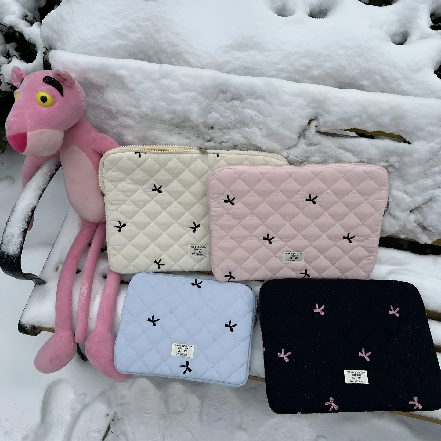 Nylon notebook storage bag with rhombus embroidery and bow, shown in light blue colour.