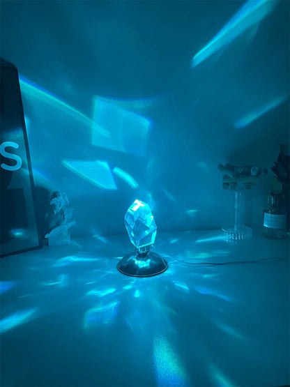 LED Crystal Night Light with remote control and 16 color options on a bedside table