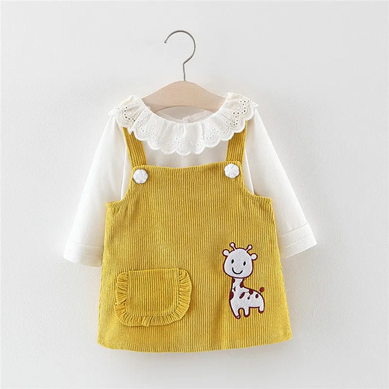 Baby girl two-piece cotton dress set with long-sleeve top and suspender skirt in yellow or pink.