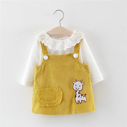 Baby girl two-piece cotton dress set with long-sleeve top and suspender skirt in yellow or pink.