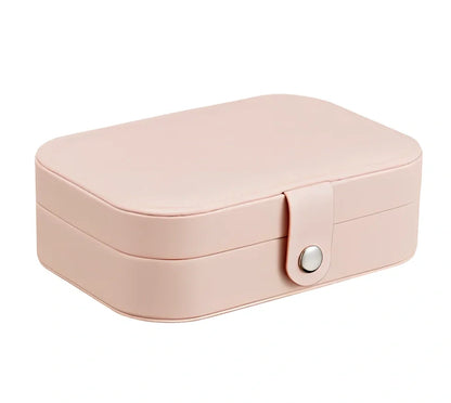 Three-layer travel jewellery box with PU leather exterior and secure closure for organised accessory storage