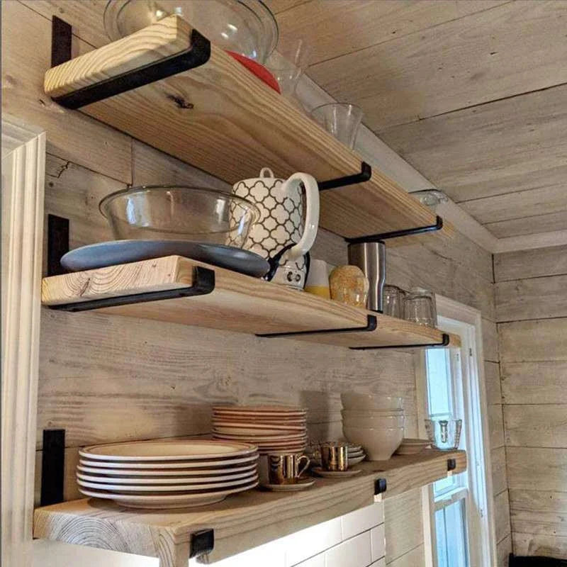 Sturdy black iron wall shelves with a rustic, industrial-chic design for organizing and displaying items in your home or office