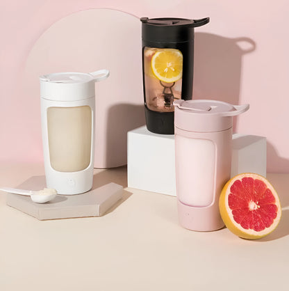 Portable automatic juice blender cup in black, blue, pink, or white, showing 650ml capacity and compact size.