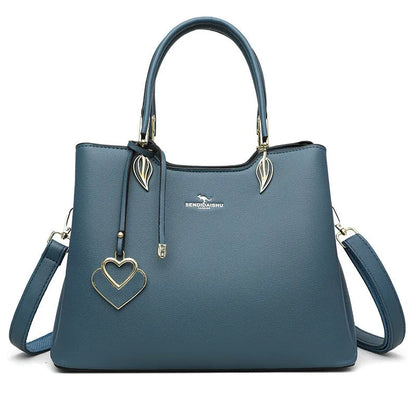 Women's black PU leather messenger bag with multi-layer shoulder strap and sewing thread detailing.
