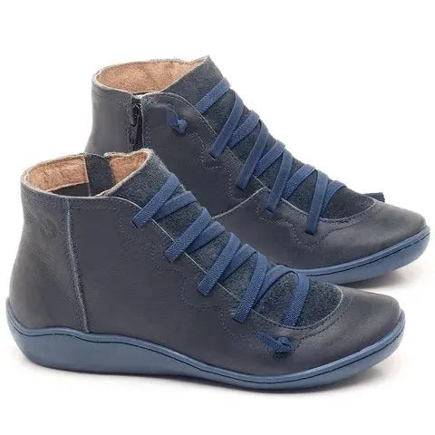 Women's casual booties with wedge heel and round toe in various colours like black and leopard print, showing rubber sole.