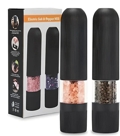 Black electric pepper grinder with transparent section showing peppercorns and ceramic grinding mechanism