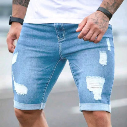 Men's sky blue denim shorts with multi-hole distressed design and a zip fly.