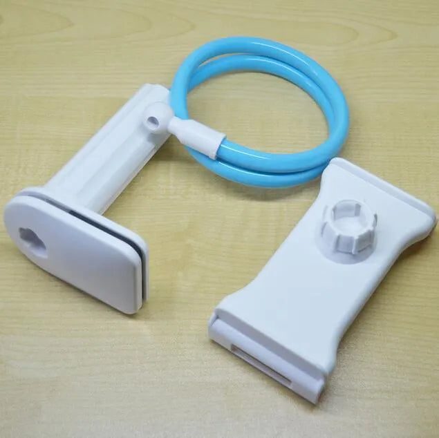 Bedside oversize flat panel handset with long arm holding a mobile phone on a table