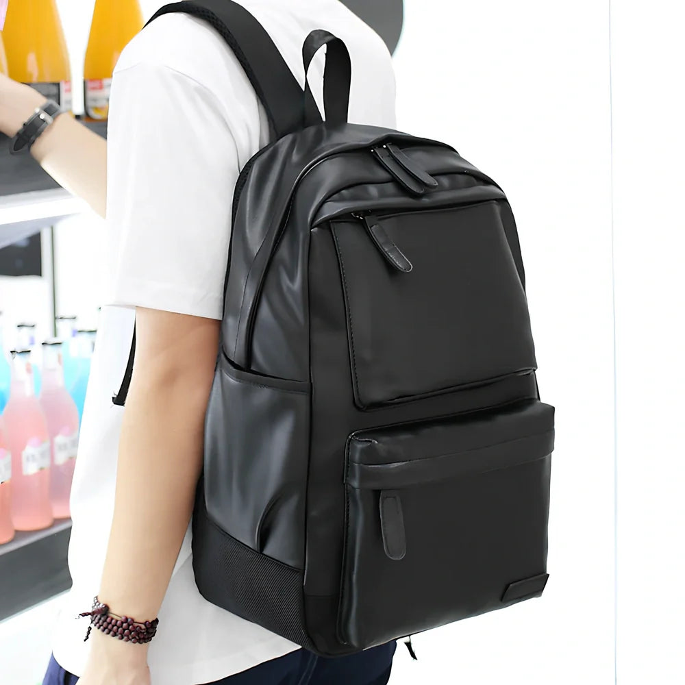 Black men's PU leather backpack with computer pocket and adjustable shoulder straps