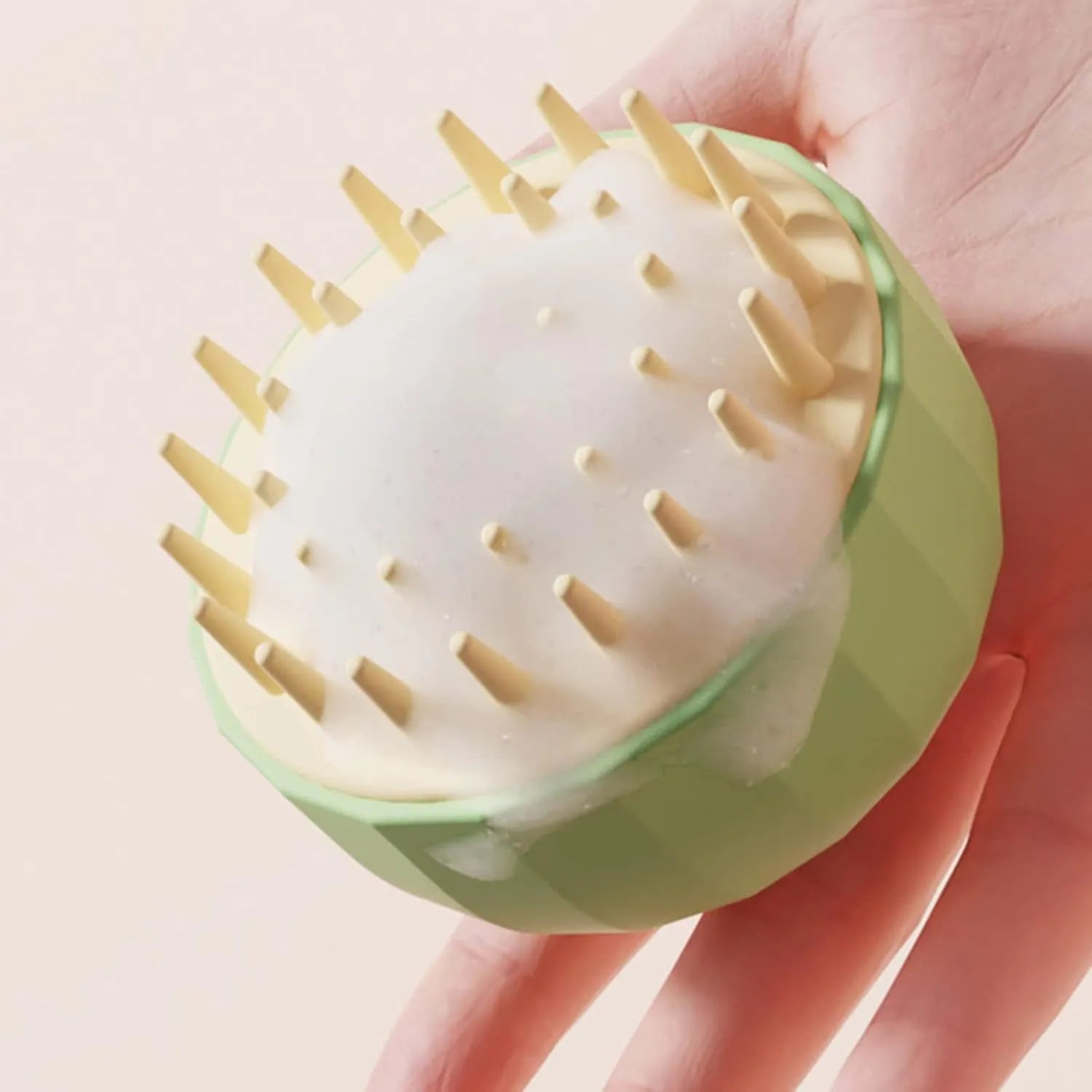 Green silicone pet bath brush with soft fingers and drain holes for washing dogs and cats