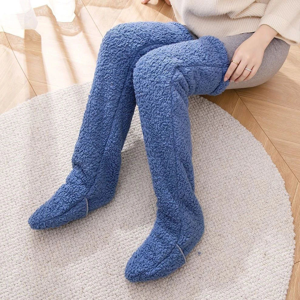 Cozy over-the-knee fuzzy socks in various colors, including brown, blue, dark gray, pink, silver, and more. Comfortable cotton design for warm, snug legs.