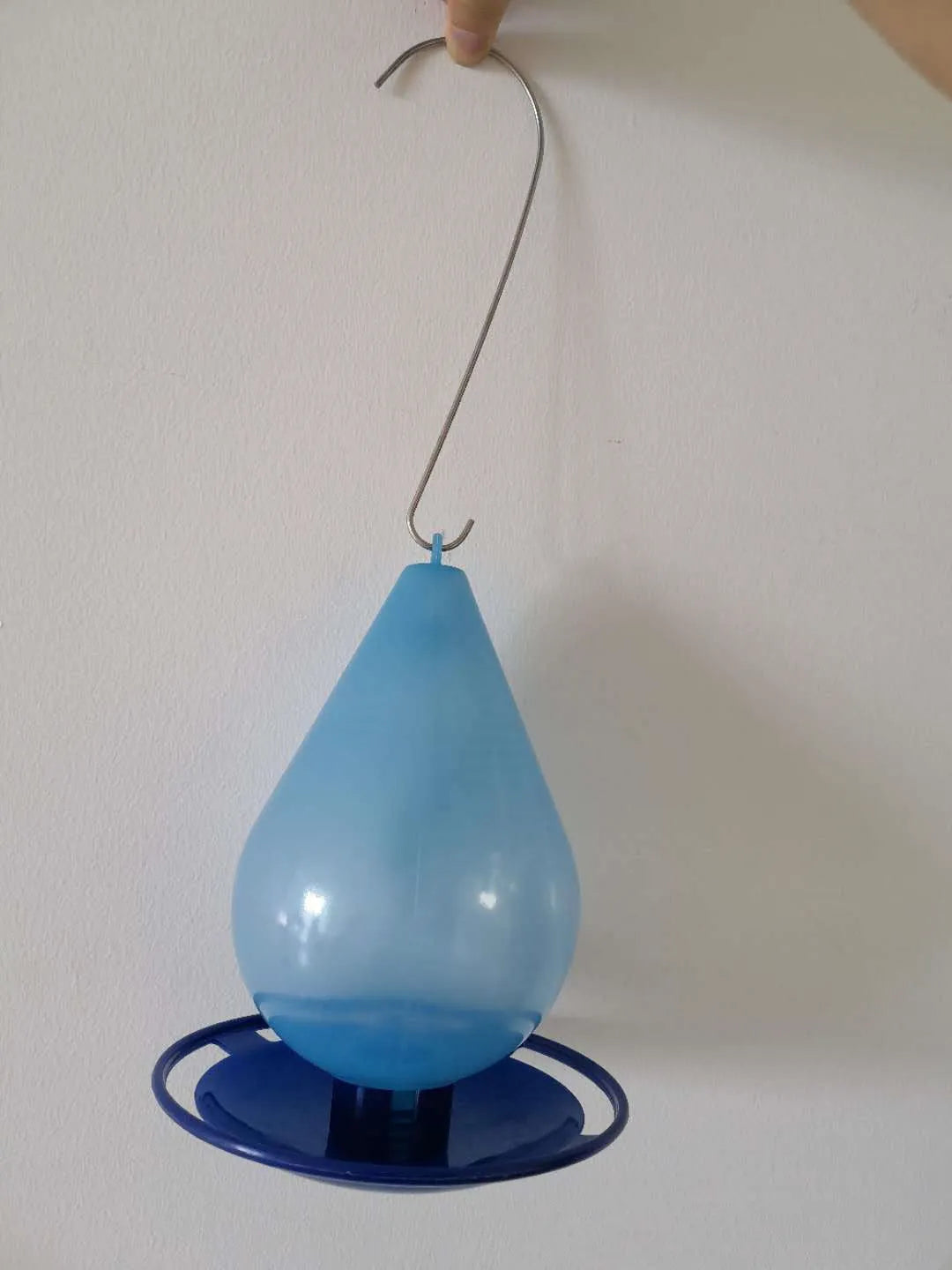 Blue water drop shaped plastic hanging hook bird feeder with bowl, cup and bucket format for garden birds.